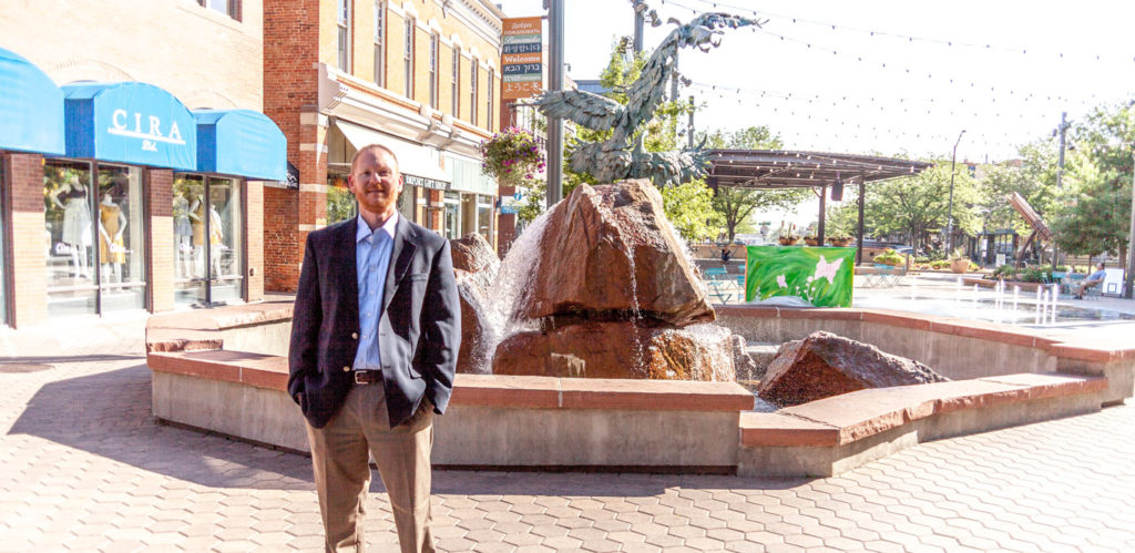 Stephen Doolittle, Criminal Defense Attorney for Northern Colorado standing in Old Town Square Fort Collins.